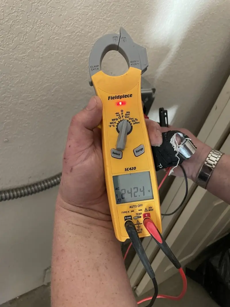 Voltage testing with clamp meter during Generator Installation in Cypress Lake